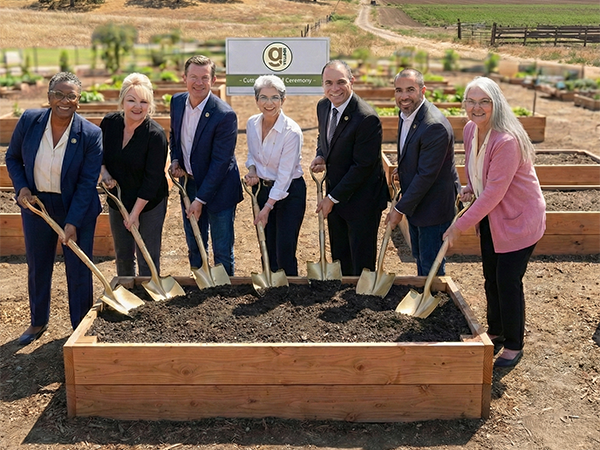 an emamel plaque detailing the elements of building a village